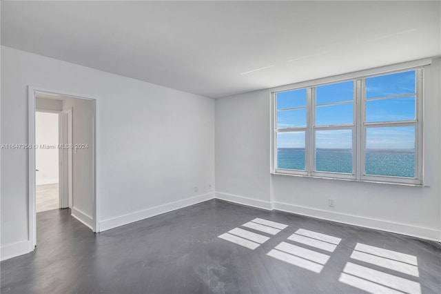 empty room featuring a water view