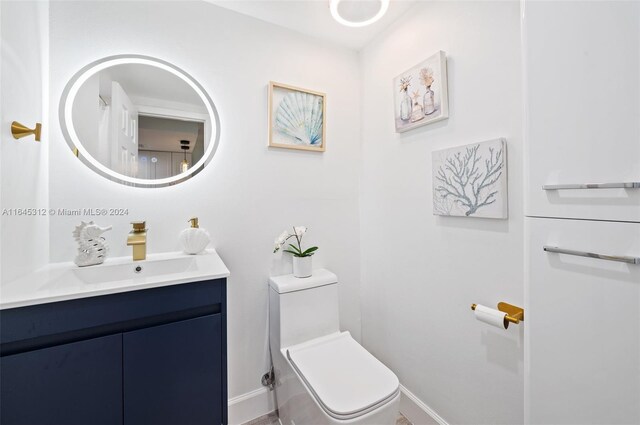 bathroom with vanity and toilet