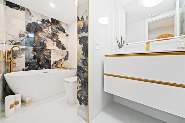 bathroom with tile patterned flooring, toilet, and a bathing tub