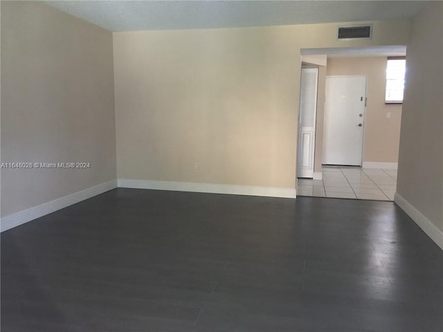 spare room featuring light wood-type flooring