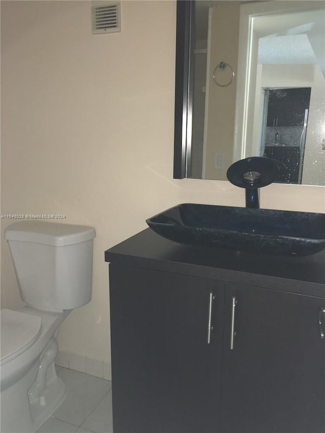 3253 Foxcroft Rd Unit G210, Miramar, FL 33025 - bathroom with vanity, tile patterned floors, toilet, and baseboards