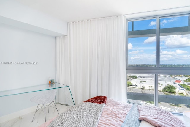 bedroom featuring multiple windows