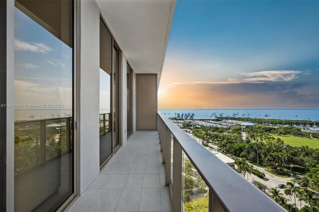 balcony at dusk with a water view