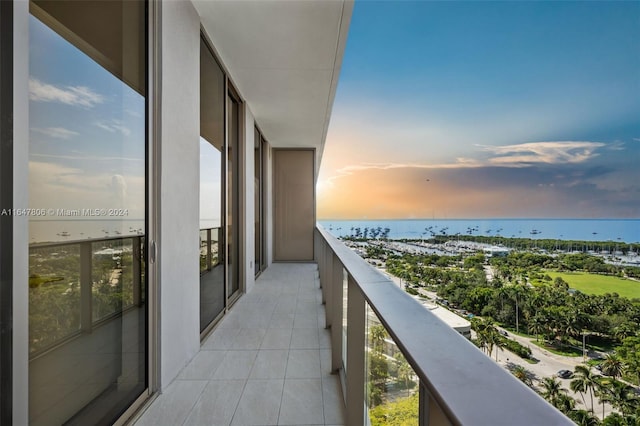 2655 S Bayshore Dr Unit 1505, Miami, FL 33133 - balcony at dusk featuring a water view