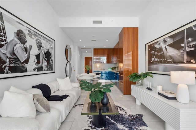 living room with visible vents and light tile patterned flooring