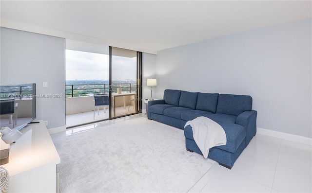 tiled living room featuring expansive windows