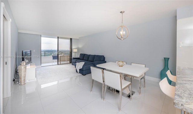 tiled dining area featuring expansive windows and an inviting chandelier