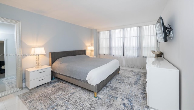 bedroom featuring light tile patterned floors