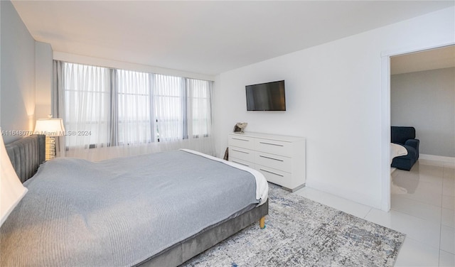 bedroom featuring light tile patterned flooring