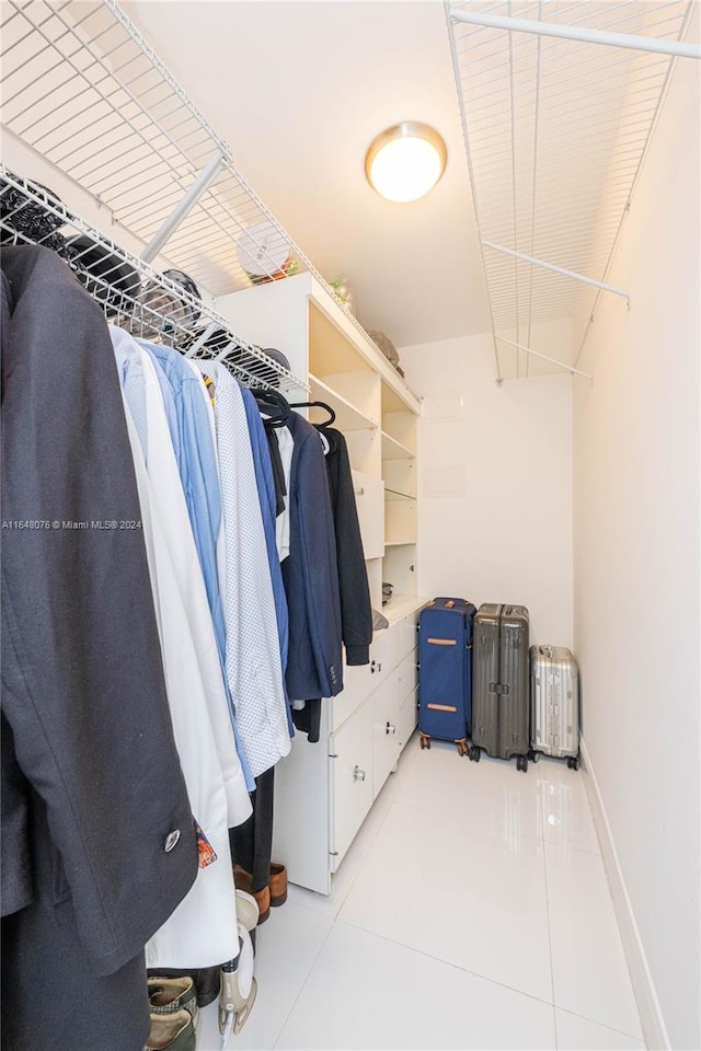 600 Three Islands Blvd Unit 1501, Hallandale Beach, FL 33009 - spacious closet featuring radiator and light tile patterned floors