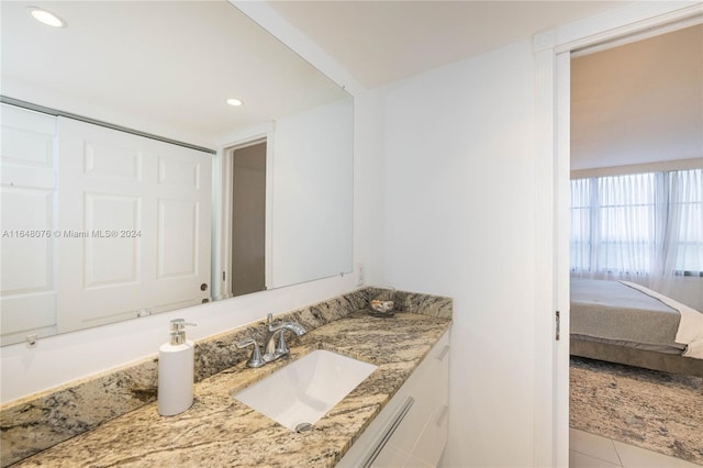 bathroom with vanity and tile patterned floors