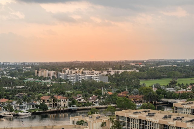 aerial view at dusk with a water view