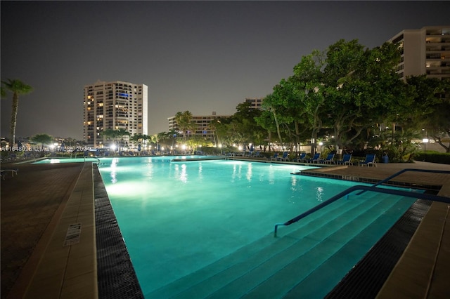 view of pool at night