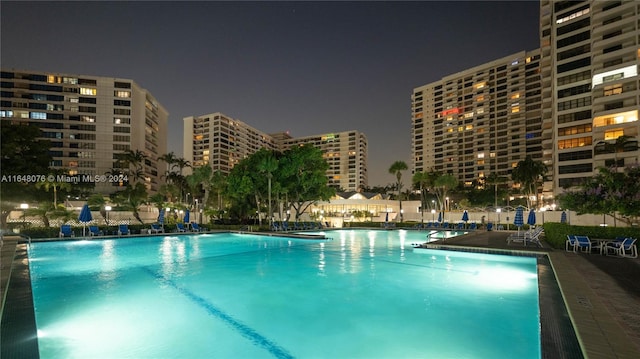 view of pool at night