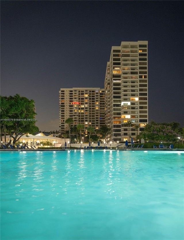 view of pool at night