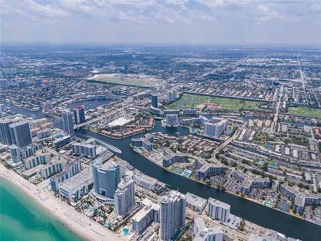 bird's eye view featuring a water view and a view of the beach