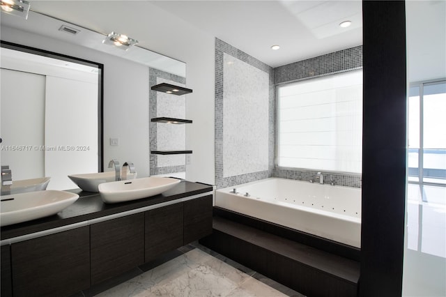 bathroom featuring vanity and a bathing tub