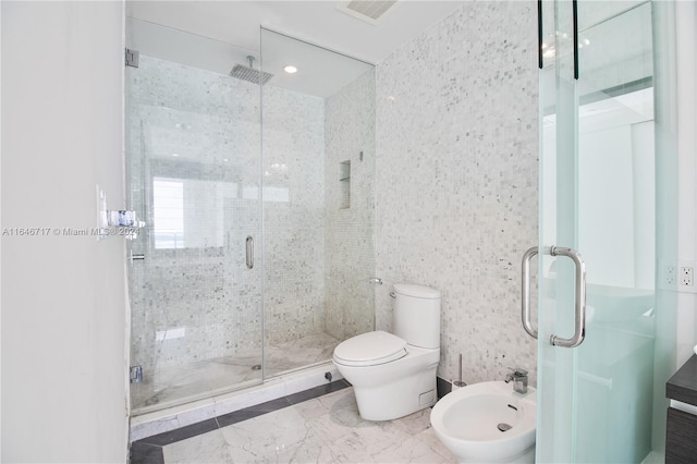 bathroom with vanity, toilet, walk in shower, and a bidet