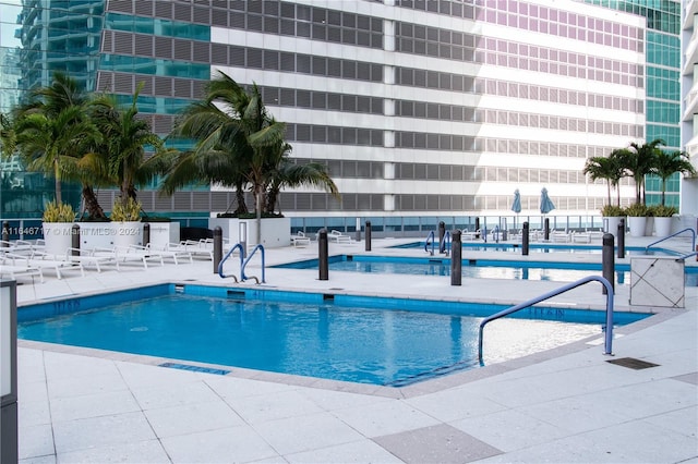 view of swimming pool with a patio area