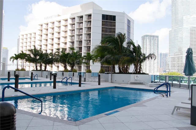 view of swimming pool featuring a patio