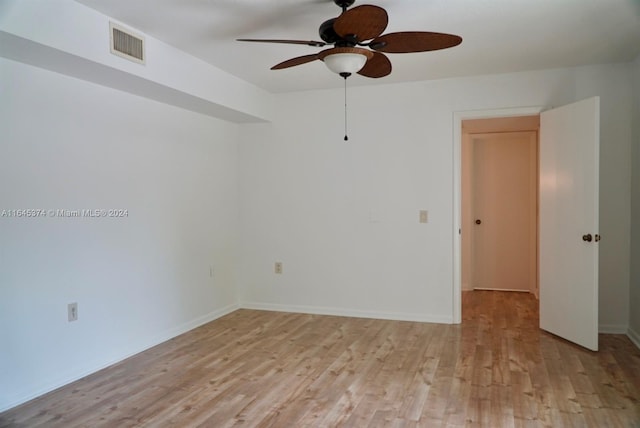 empty room with light hardwood / wood-style floors and ceiling fan