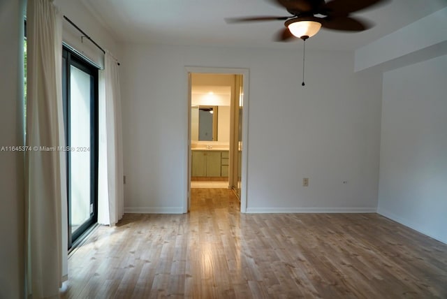 unfurnished bedroom with light hardwood / wood-style flooring, ceiling fan, and ensuite bathroom