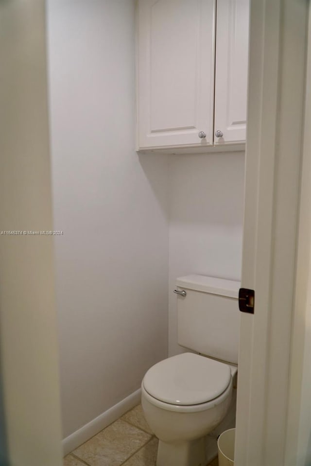 bathroom featuring tile patterned flooring and toilet