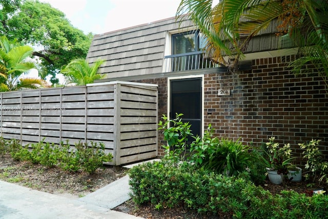 view of property exterior featuring a balcony