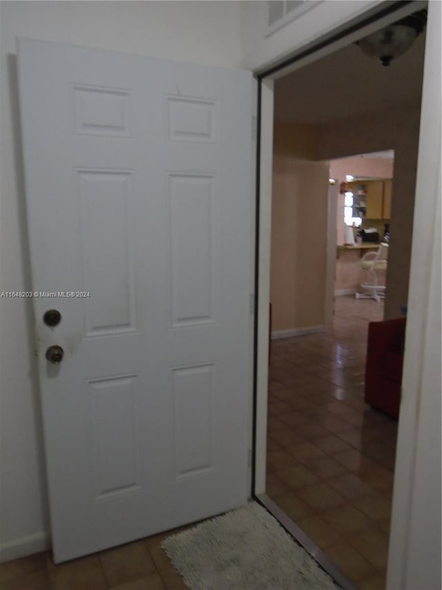 158 NW 18th Ct, Miami, FL 33125 - hallway with tile patterned flooring and baseboards