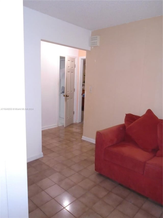 158 NW 18th Ct, Miami, FL 33125 - tiled living area featuring baseboards