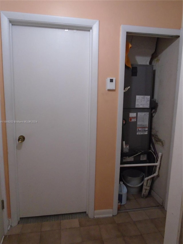 158 NW 18th Ct, Miami, FL 33125 - utility room featuring heating unit