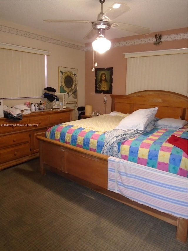 158 NW 18th Ct, Miami, FL 33125 - bedroom with dark colored carpet and ceiling fan