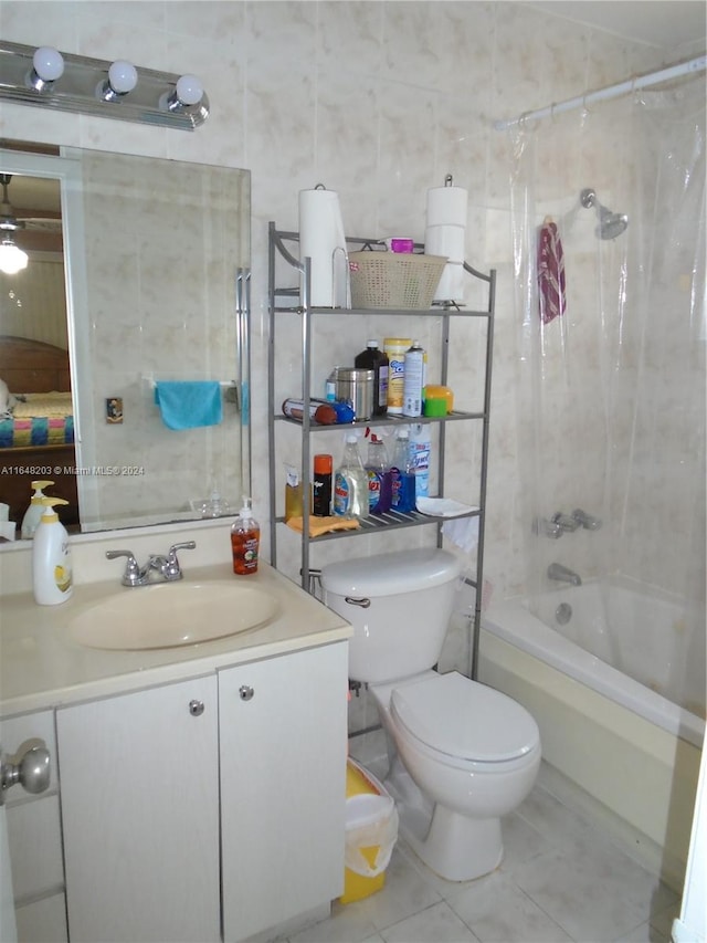 full bathroom with vanity, shower / bath combination with curtain, tile patterned flooring, toilet, and tile walls