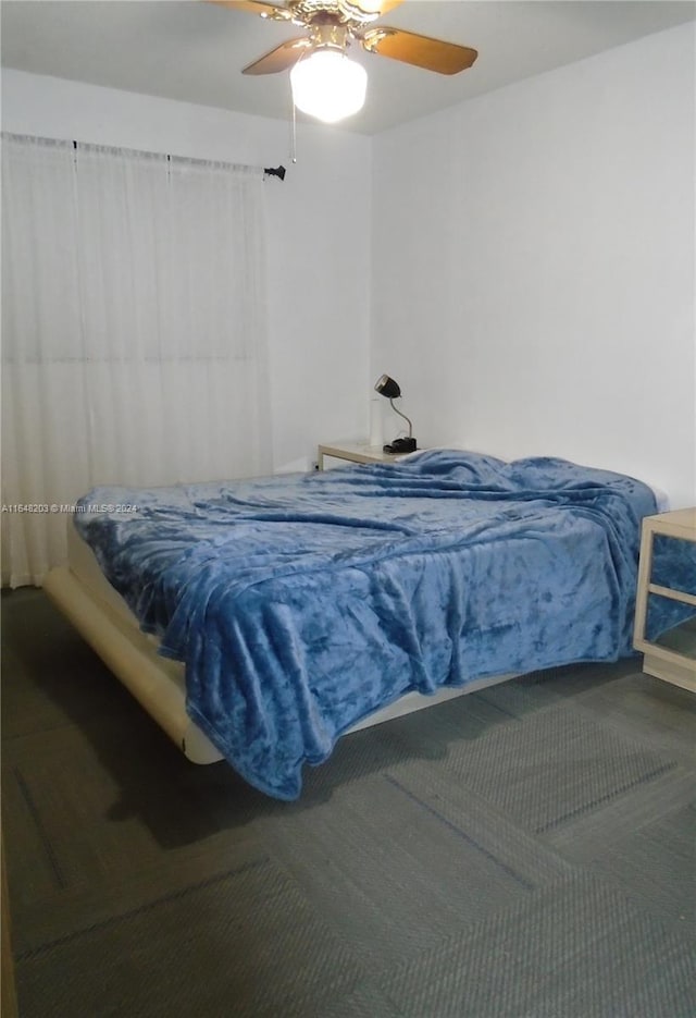 158 NW 18th Ct, Miami, FL 33125 - carpeted bedroom with ceiling fan