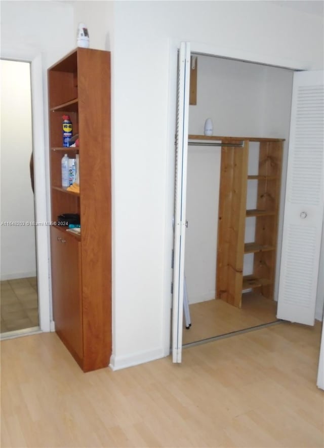 unfurnished bedroom with light wood-type flooring