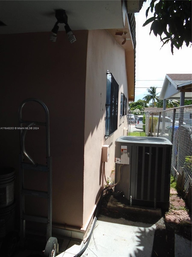 158 NW 18th Ct, Miami, FL 33125 - view of side of home featuring stucco siding and ceiling fan