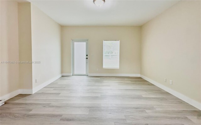 unfurnished room featuring light hardwood / wood-style flooring