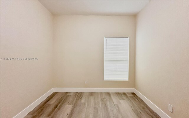 unfurnished room featuring light hardwood / wood-style floors