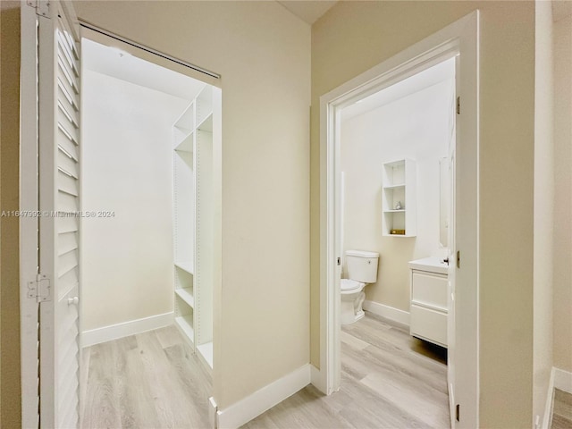 bathroom with vanity, hardwood / wood-style floors, and toilet