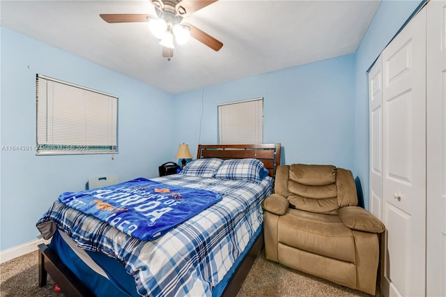 bedroom with carpet, ceiling fan, and a closet