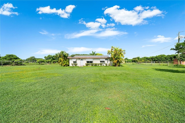 view of yard with a rural view