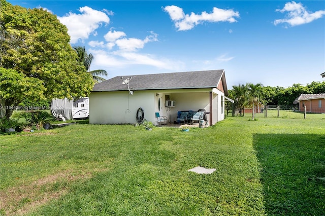 rear view of house with a lawn