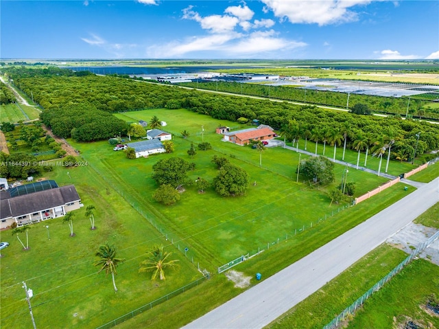 birds eye view of property with a rural view and a water view