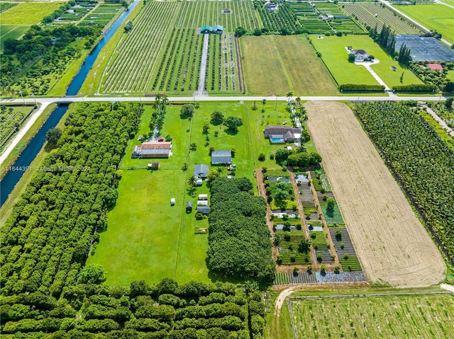 birds eye view of property with a rural view