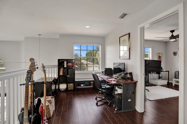 office space featuring a textured ceiling, ceiling fan, and dark hardwood / wood-style floors