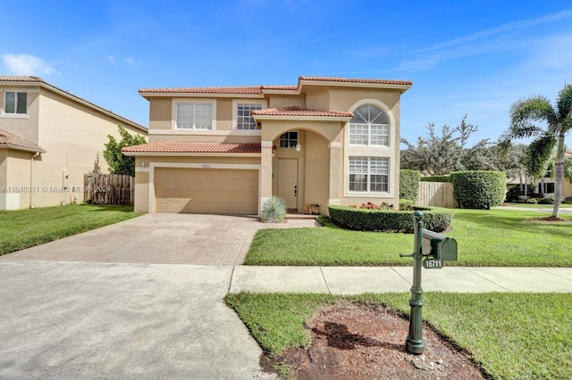 mediterranean / spanish-style house with a garage and a front lawn