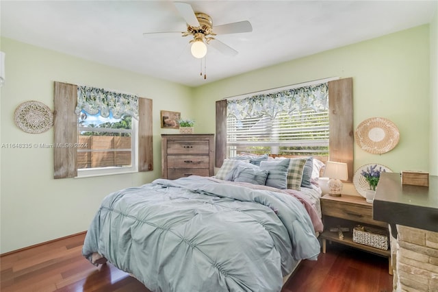 bedroom with dark wood-type flooring and ceiling fan