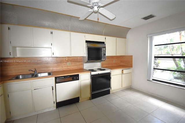 kitchen featuring range with electric stovetop, visible vents, white dishwasher, a sink, and black microwave