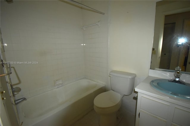 bathroom with shower / washtub combination, vanity, and toilet