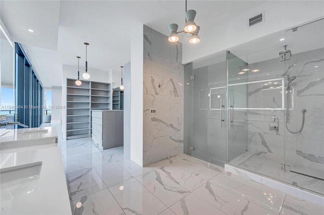 bathroom with vanity and a shower with shower door